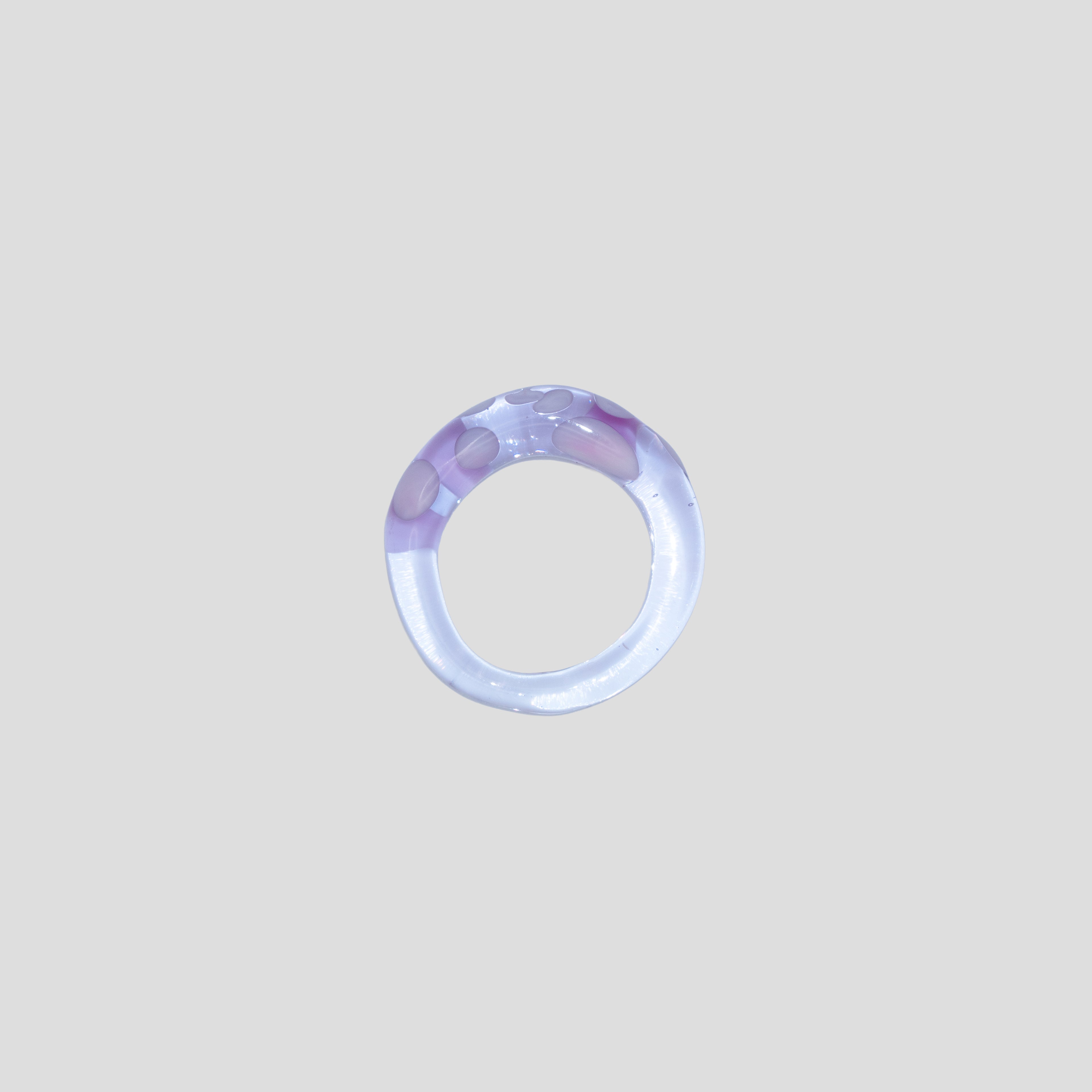 pink clear glass ring on a light gray background from all rivers jewelry