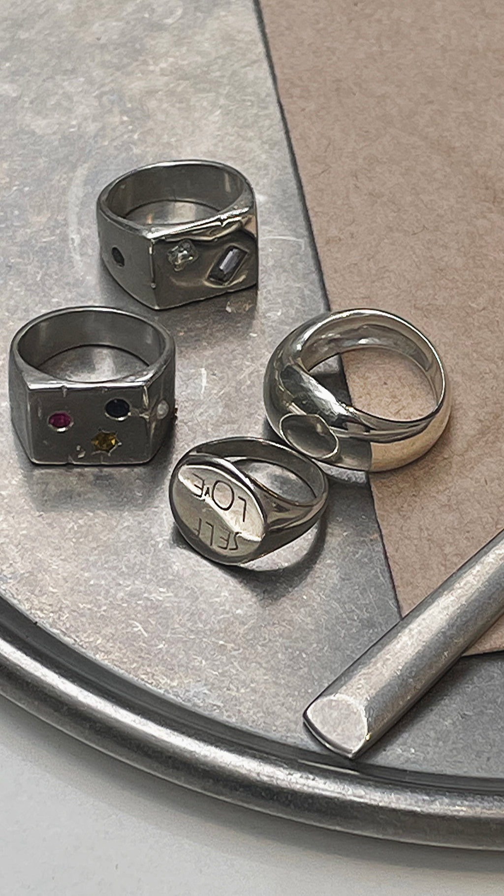 all rivers silver rings on a tray